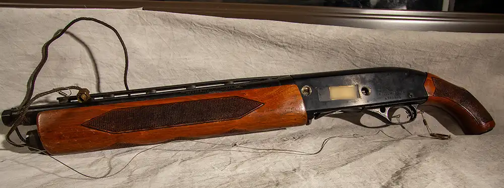 The real 12-gauge Winchester 1400 shotgun rigged by Tony Kiritsis during the 1977 Indianapolis hostage crisis — the homemade “dead man’s line” device that inspired the modern term “dead man’s wire.